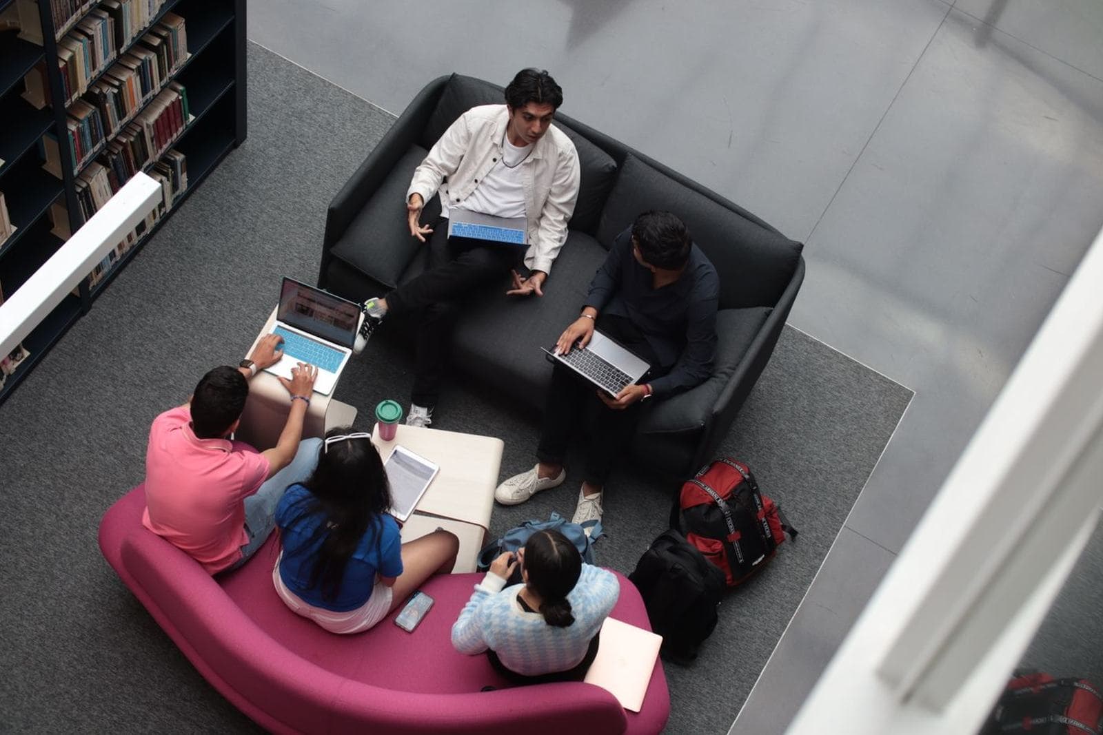 A small group of students together on campus or in a lounge