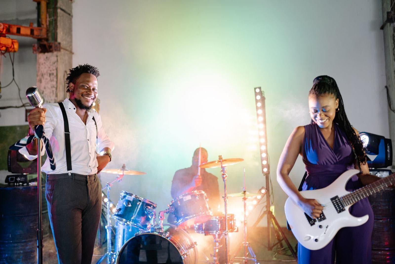 A band or musician performing live on a lit stage